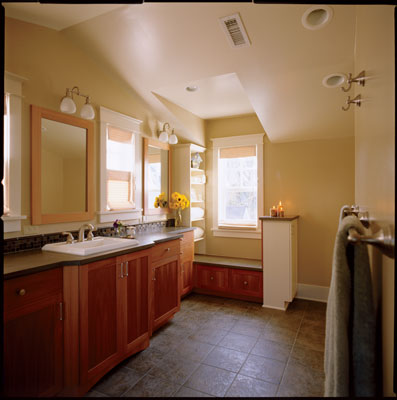 
The Gregorys preserved the warmth and light from the bathroom’s orginal four windows and created a cozy window seat in the process.
